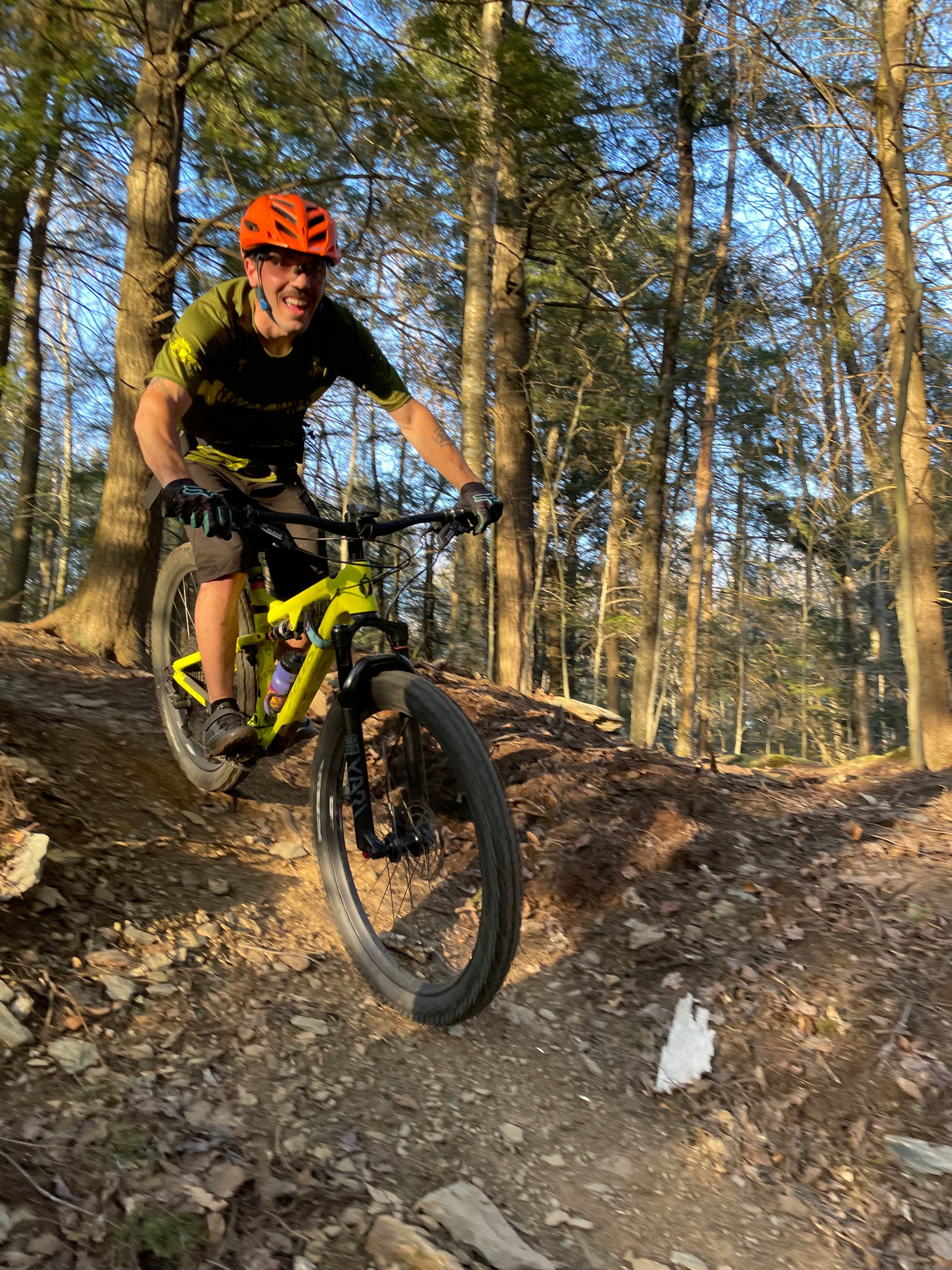 a mountain biker riding down a trail